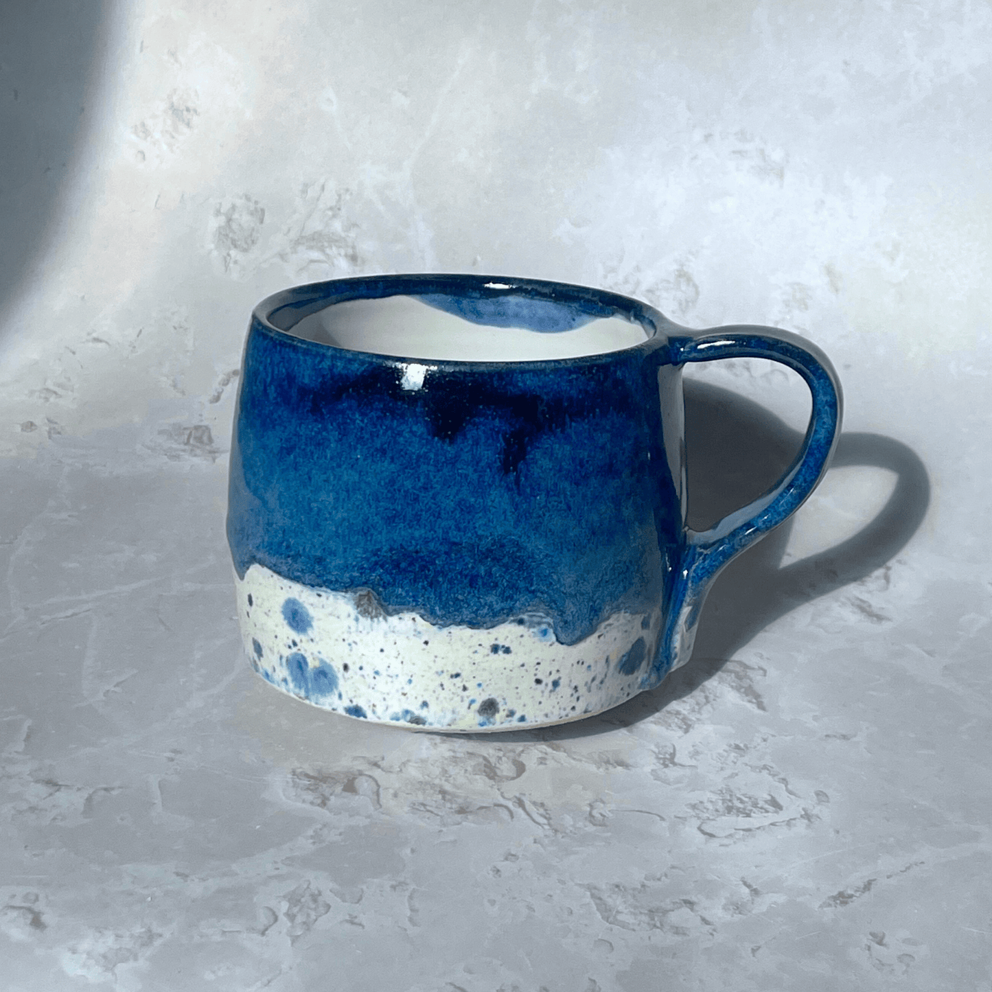 Ella Fletcher Designs Handmade Ceramics Round Large Mug in Navy Shoreline with dark blue and multi-coloured speckled design