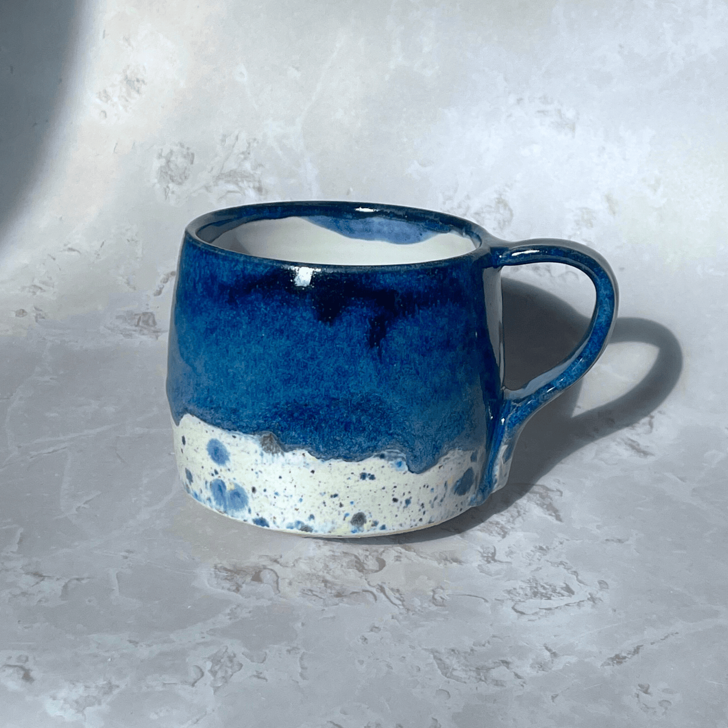 Ella Fletcher Designs Handmade Ceramics Round Large Mug in Navy Shoreline with dark blue and multi-coloured speckled design