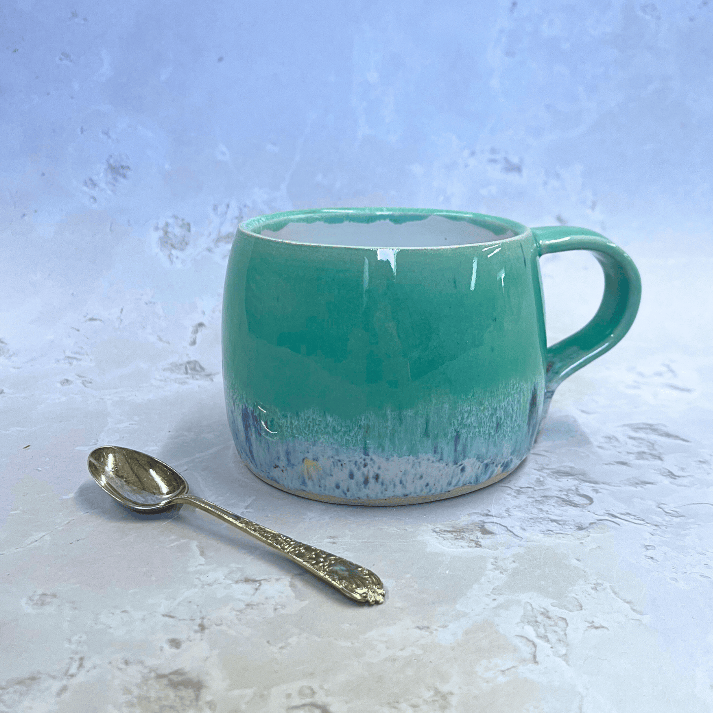 Ella Fletcher Designs Handmade Ceramics Round Large Mug in Green Shoreline with pale green and multi-coloured speckled design inspired by the Scottish shoreline