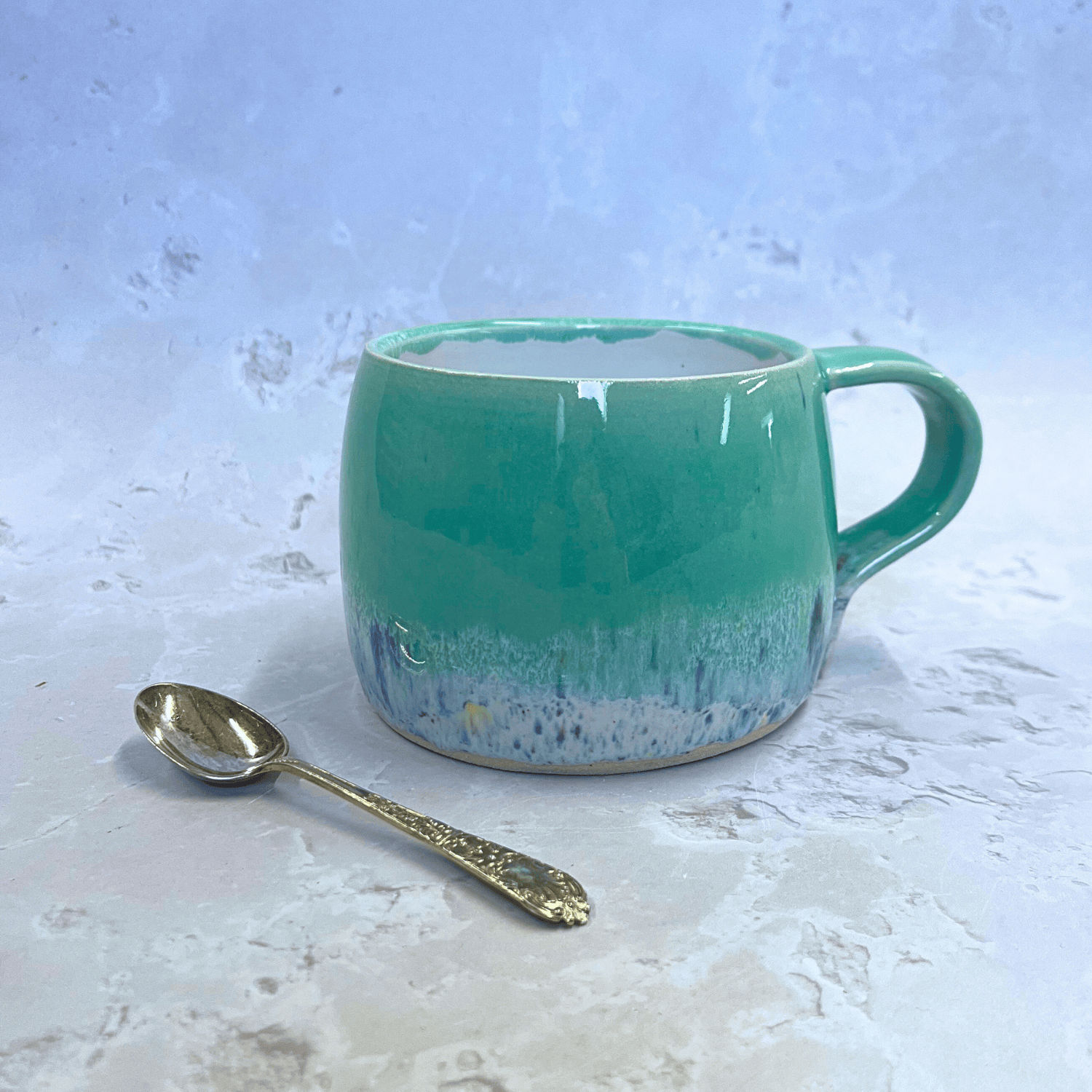 Ella Fletcher Designs Handmade Ceramics Round Large Mug in Green Shoreline with pale green and multi-coloured speckled design inspired by the Scottish shoreline