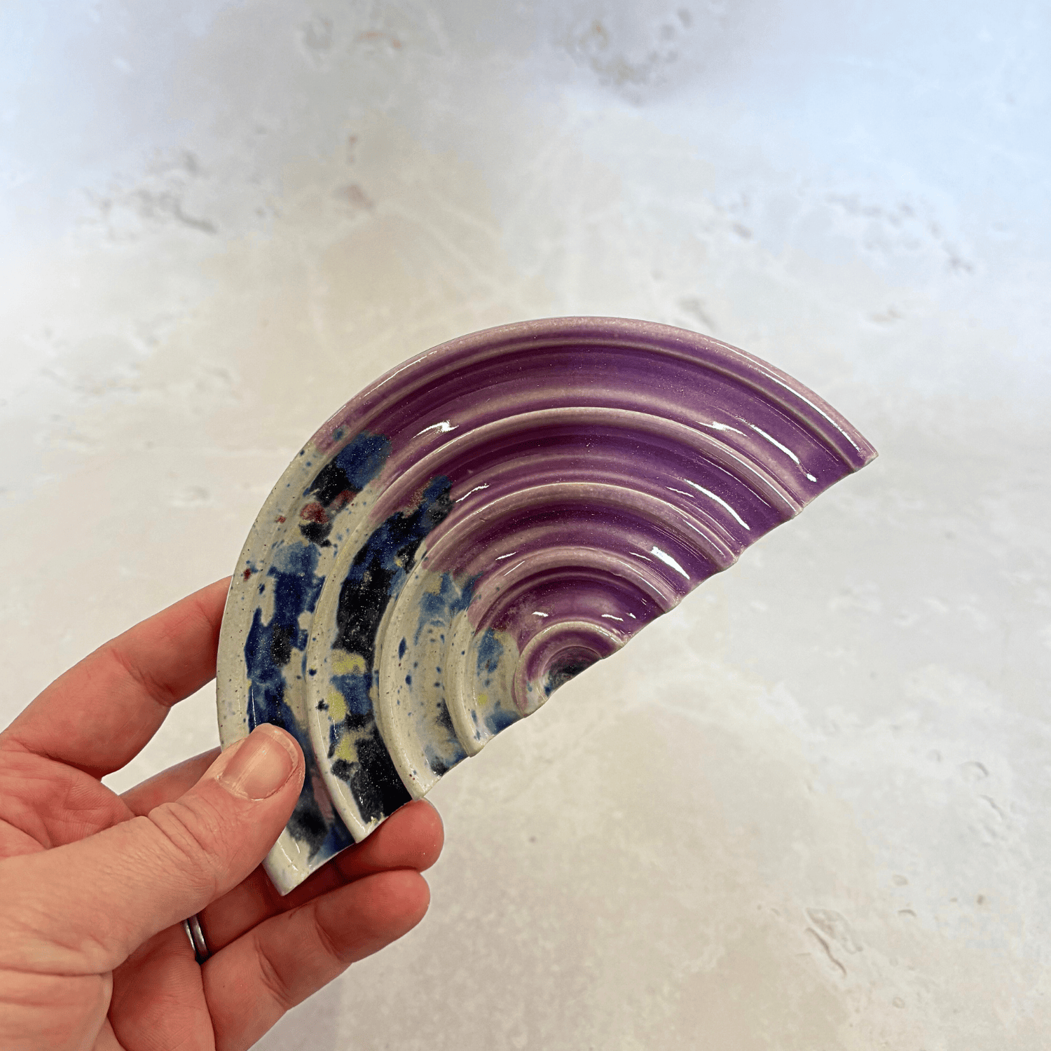 Ella Fletcher Designs Handmade Ceramic Soap Dish in Pink Shoreline design, semi-circle with grooved edges, half pink and half multi-coloured speckles