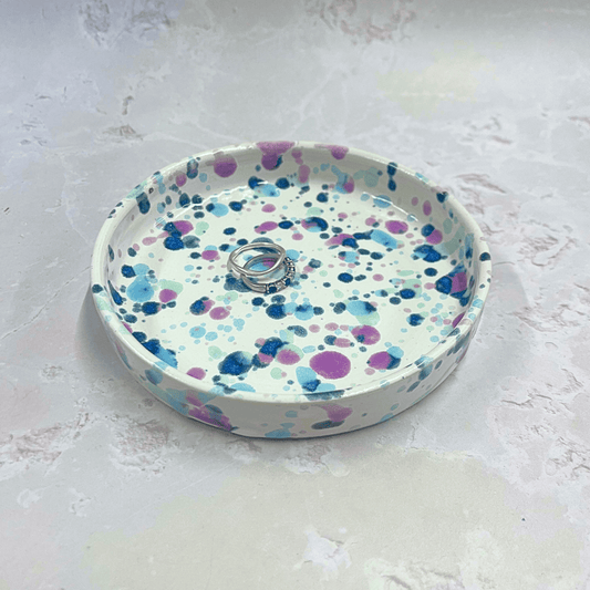 Ella Fletcher Designs Handmade Ceramic Trinket Dish in Sweetpea Design, white background with speckles of blues and pink to resemble sweet pea flowers, featured with rings