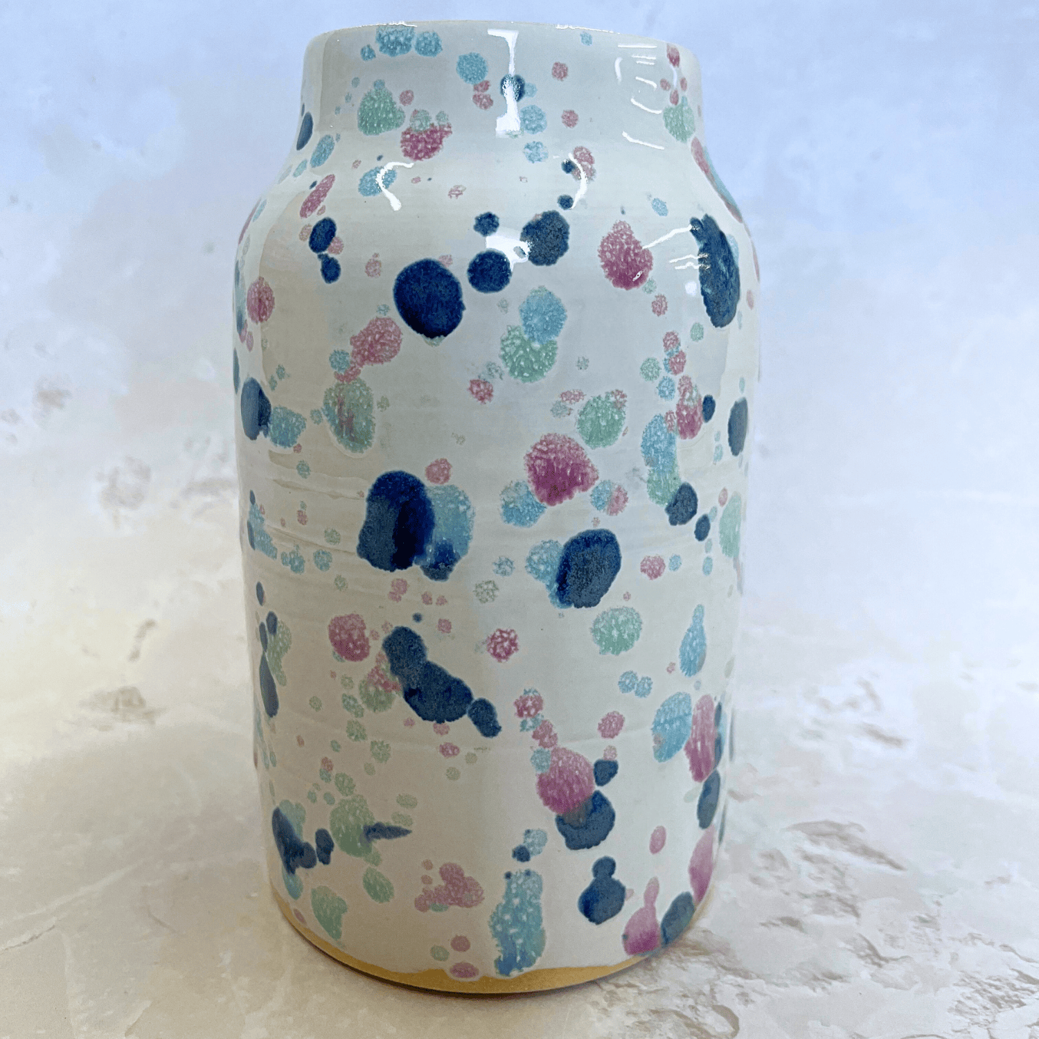 Ella Fletcher Designs Handmade Pottery Large Vase in Sweetpea Design, splatters of pinks and blues on a white background of a large handmade vase