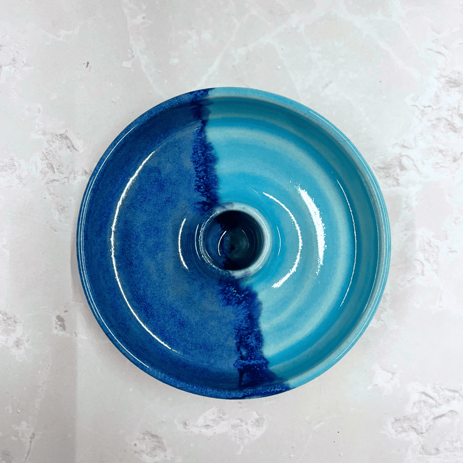 Ella Fletcher Designs Handmade Ceramic Candlestick holder in Blue Scottish Landscape design, top view of circular candlestick holder with layered dark and light blues 