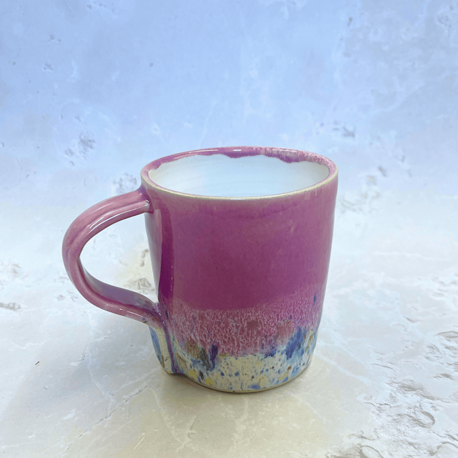 Ella Fletcher Designs Handmade Pottery Mug in Pale Pink Shoreline Design, pale pink top half with speckled bottom half inspired by the shoreline at East Lothian beaches