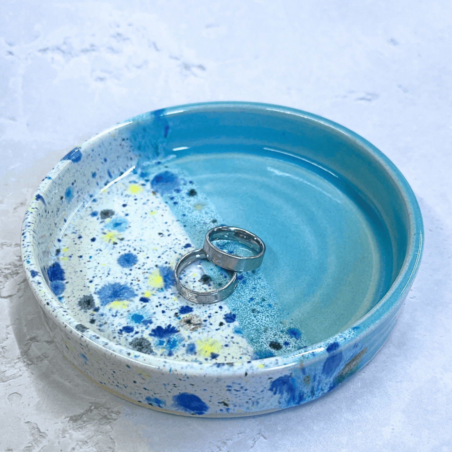 Ella Fletcher Designs Handmade Ceramics Trinket Dish in Pale Blue Shoreline Design, small round pale blue and multicolour speckles dish with rings inside