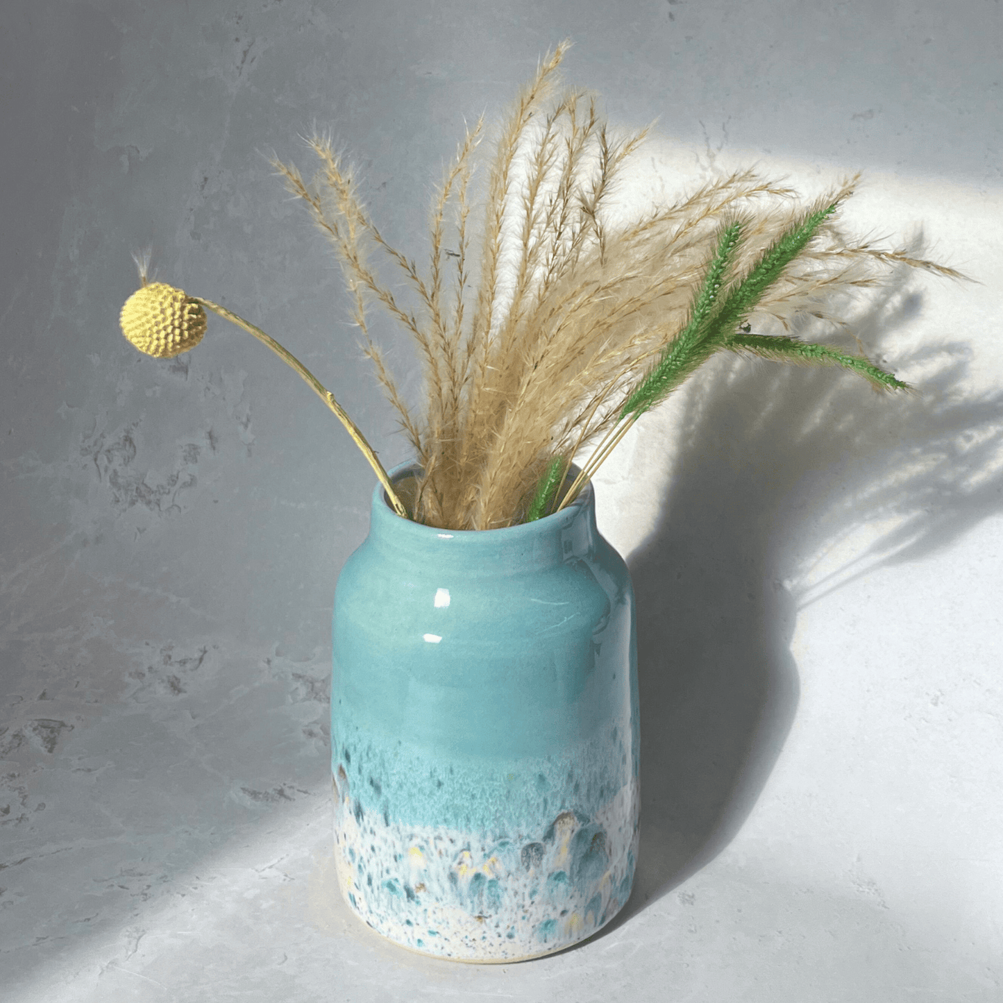 Ella Fletcher Designs Handmade Ceramic Vase in Pale Blue Shoreline Design - vase with solid blue top and multi-coloured speckles