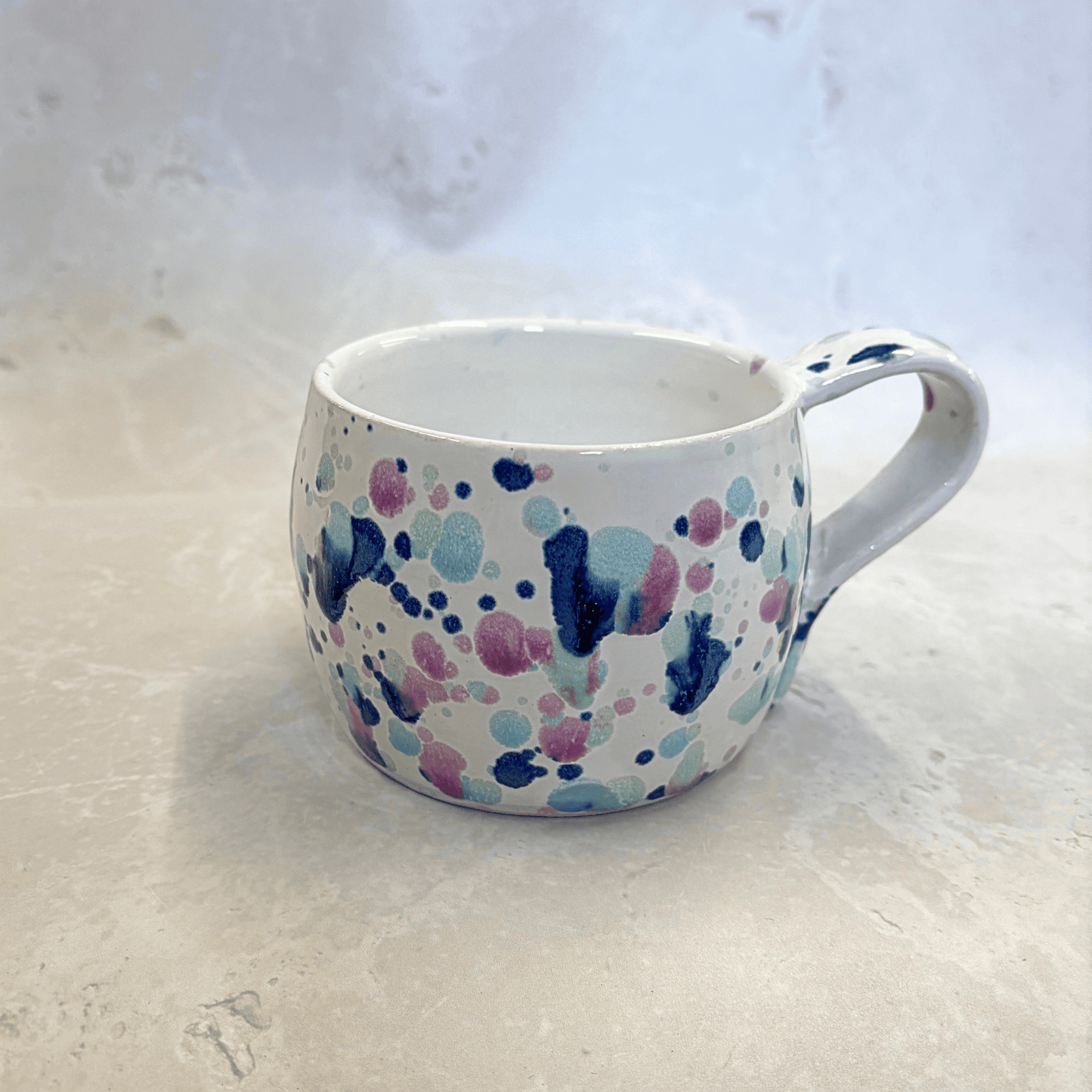 Ella Fletcher Designs Handmade Ceramic Large Round Mug in Sweepea design, round mug featuring splashes of blues, pinks and green