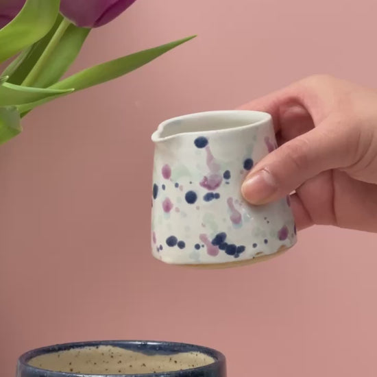 Video of tiny jug pouring milk into a mug